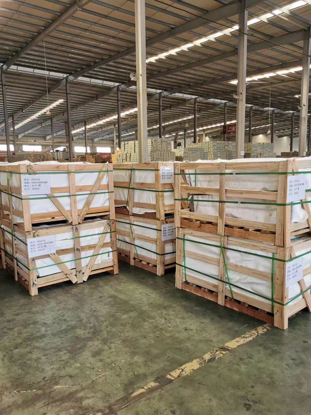 warehouse of outdoor porcelain pavers stacked on pallets