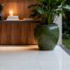 Nova Speck white grey beige fine speckled terrazzo look glazed polished porcelain tile installed floor effect photo interior project photo glossy surface